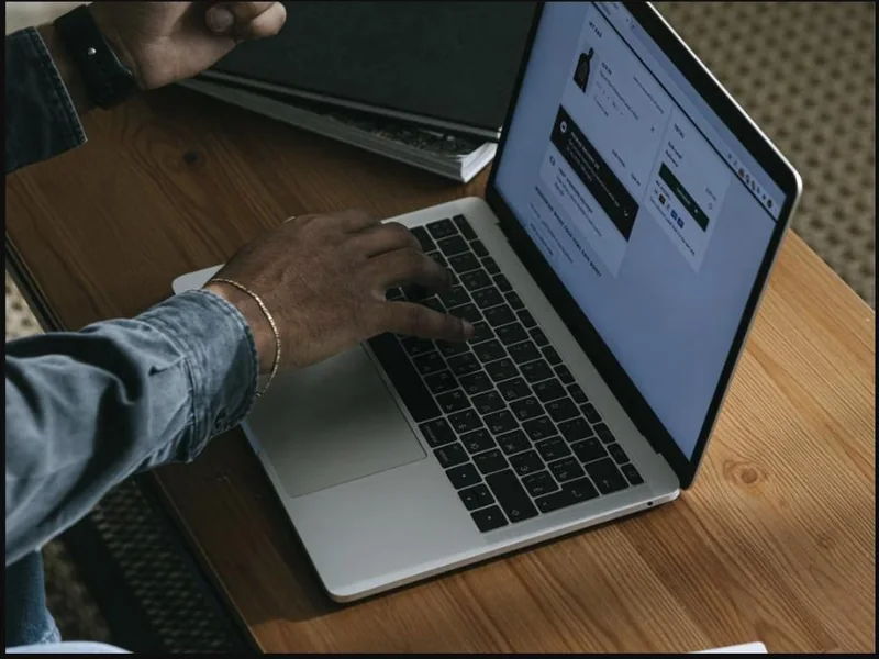 A visitor engaging with a business website on a laptop